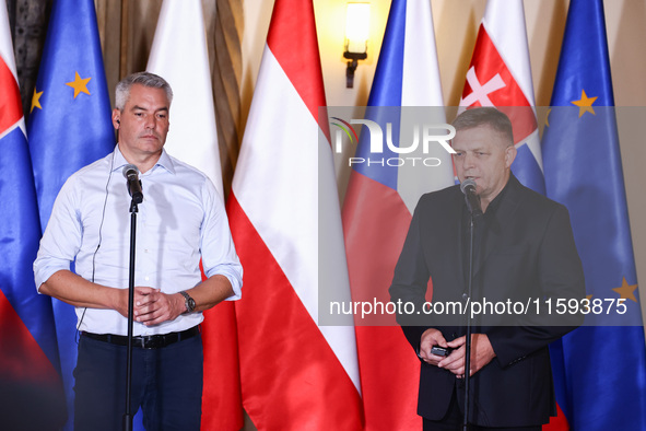 Austrian Chacellor Karl Nehammer and Slovak Prime Minister Robert Fico attend a press conference at the town hall in in Wroclaw, Poland on S...