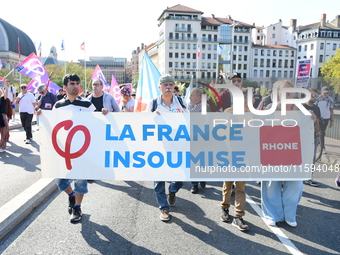 Protesters against the government of Michel Barnier and French President Emmanuel Macron in Lyon, France, on September 21, 2024. (