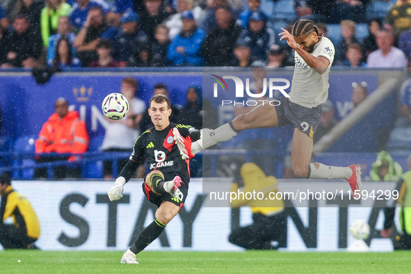 #30, Mads Hermansen of Leicester City clears the ball under pressure from #9, Dominic Calvert-Lewin of Everton during the Premier League mat...