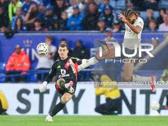 #30, Mads Hermansen of Leicester City clears the ball under pressure from #9, Dominic Calvert-Lewin of Everton during the Premier League mat...