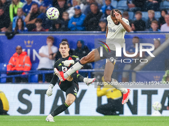 #30, Mads Hermansen of Leicester City clears the ball under pressure from #9, Dominic Calvert-Lewin of Everton during the Premier League mat...