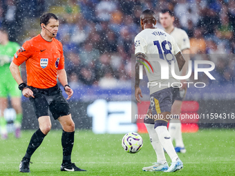 Referee Darren England restarts the game with a drop ball to #18, Ashley Young of Everton during the Premier League match between Leicester...