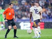 Referee Darren England restarts the game with a drop ball to #18, Ashley Young of Everton during the Premier League match between Leicester...