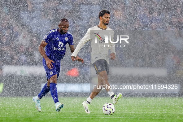 Ilman Ndiaye of Everton is chased by Jordan Ayew of Leicester City during the Premier League match between Leicester City and Everton at the...