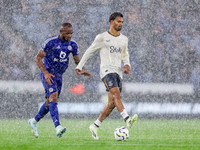 Ilman Ndiaye of Everton is chased by Jordan Ayew of Leicester City during the Premier League match between Leicester City and Everton at the...