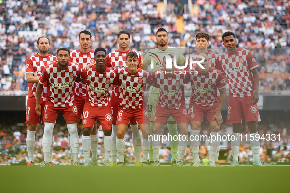 Girona FC players pose for a team photo prior to the LaLiga EA Sports match between Valencia CF and Girona FC at Mestalla stadium in Valenci...