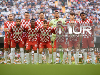 Girona FC players pose for a team photo prior to the LaLiga EA Sports match between Valencia CF and Girona FC at Mestalla stadium in Valenci...