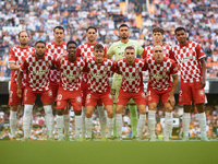 Girona FC players pose for a team photo prior to the LaLiga EA Sports match between Valencia CF and Girona FC at Mestalla stadium in Valenci...