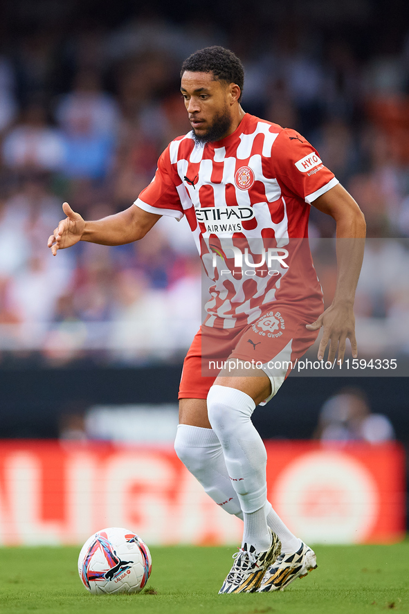 Arnaut Danjuma of Girona FC is in action during the LaLiga EA Sports match between Valencia CF and Girona FC at Mestalla stadium in Valencia...