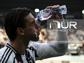 Juventus forward Dusan Vlahovic (9) refreshes himself during the Serie A football match number 5 between Juventus and Napoli in Turin, Italy...