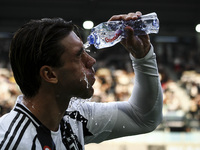 Juventus forward Dusan Vlahovic (9) refreshes himself during the Serie A football match number 5 between Juventus and Napoli in Turin, Italy...