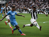 Juventus defender Bremer (3) tackles Napoli forward Matteo Politano (21) during the Serie A football match number 5 between Juventus and Nap...