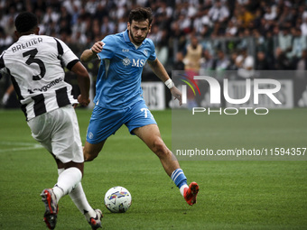 Napoli forward Khvicha K'varatskhelia (77) is in action during the Serie A football match number 5 between Juventus and Napoli in Turin, Pie...