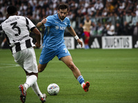 Napoli forward Khvicha K'varatskhelia (77) is in action during the Serie A football match number 5 between Juventus and Napoli in Turin, Pie...