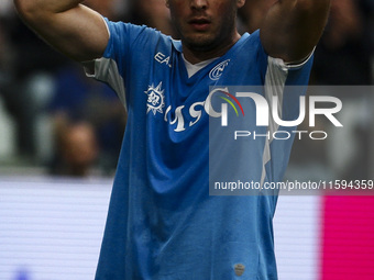 Napoli defender Amir Rrahmani (13) shows dejection during the Serie A football match number 5 between Juventus and Napoli in Turin, Piedmont...