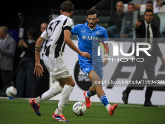 Napoli forward Khvicha K'varatskhelia (77) is in action during the Serie A football match number 5 between Juventus and Napoli in Turin, Pie...