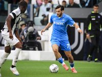 Napoli forward Khvicha K'varatskhelia (77) is in action during the Serie A football match number 5 between Juventus and Napoli in Turin, Pie...