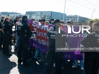 Police approach the dozen counter-protesters who block the street as thousands of people take part in the annual pro-life demonstration orga...