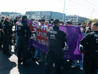 Police approach the dozen counter-protesters who block the street as thousands of people take part in the annual pro-life demonstration orga...