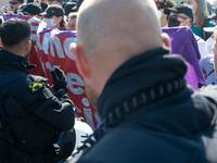 Police approach the dozen counter-protesters who block the street as thousands of people take part in the annual pro-life demonstration orga...