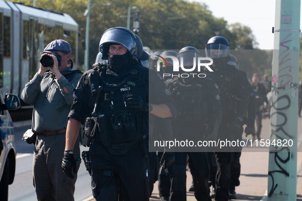 Police approach the dozen counter-protesters who block the street as thousands of people take part in the annual pro-life demonstration orga...