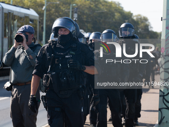 Police approach the dozen counter-protesters who block the street as thousands of people take part in the annual pro-life demonstration orga...