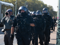 Police approach the dozen counter-protesters who block the street as thousands of people take part in the annual pro-life demonstration orga...