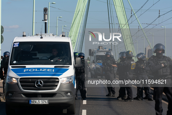 Police approach the dozen counter-protesters who block the street as thousands of people take part in the annual pro-life demonstration orga...