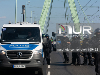 Police approach the dozen counter-protesters who block the street as thousands of people take part in the annual pro-life demonstration orga...