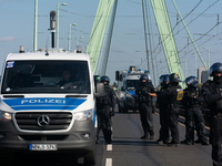 Police approach the dozen counter-protesters who block the street as thousands of people take part in the annual pro-life demonstration orga...