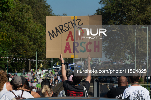 Several counter-protesters hold a sign reading ''March on the Ass'' as thousands of people take part in an annual pro-life demonstration org...