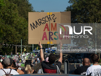 Several counter-protesters hold a sign reading ''March on the Ass'' as thousands of people take part in an annual pro-life demonstration org...