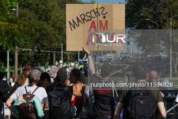 Several counter-protesters hold a sign reading ''March on the Ass'' as thousands of people take part in an annual pro-life demonstration org...