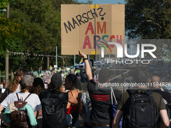 Several counter-protesters hold a sign reading ''March on the Ass'' as thousands of people take part in an annual pro-life demonstration org...