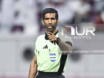 Referee Khamis Mohammed Al-Marri gestures during the Ooredoo Qatar Stars League 24/25 match between Al-Sadd SC and Al Duhail SC at Khalifa I...