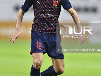 Karim Buddaif of Al Duhail SC plays in the Ooredoo Qatar Stars League 24/25 match between Al-Sadd SC and Al Duhail SC at Khalifa Internation...