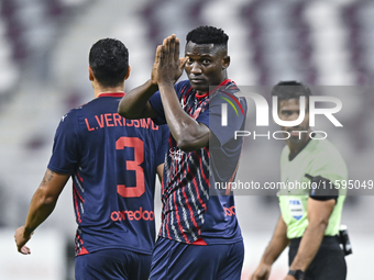 Michael Olunga of Al Duhail SC celebrates after scoring a goal during the Ooredoo Qatar Stars League 24/25 match between Al-Sadd SC and Al D...