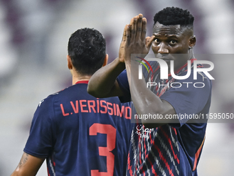 Michael Olunga of Al Duhail SC celebrates after scoring a goal during the Ooredoo Qatar Stars League 24/25 match between Al-Sadd SC and Al D...