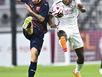 Mohamed Camara (R) of Al-Sadd SC battles for the ball with Luis Alberto (L) of Duhail SC during the Ooredoo Qatar Stars League 24/25 match b...