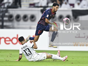 Abdulla Badr Alyazidi (L) of Al-Sadd SC battles for the ball with Homam El Amin (R) of Duhail SC during the Ooredoo Qatar Stars League 24/25...