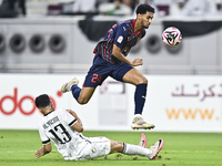 Abdulla Badr Alyazidi (L) of Al-Sadd SC battles for the ball with Homam El Amin (R) of Duhail SC during the Ooredoo Qatar Stars League 24/25...