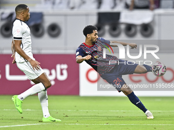 Pedro Miguel Correia of Al-Sadd SC battles for the ball with Homam El Amin of Duhail SC during the Ooredoo Qatar Stars League 24/25 match be...