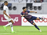 Pedro Miguel Correia of Al-Sadd SC battles for the ball with Homam El Amin of Duhail SC during the Ooredoo Qatar Stars League 24/25 match be...