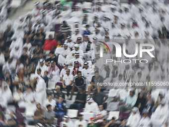 Fans of Al Sadd SC cheer for their team during the Ooredoo Qatar Stars League 24/25 match between Al-Sadd SC and Al Duhail SC at Khalifa Int...