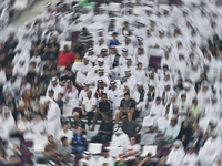 Fans of Al Sadd SC cheer for their team during the Ooredoo Qatar Stars League 24/25 match between Al-Sadd SC and Al Duhail SC at Khalifa Int...