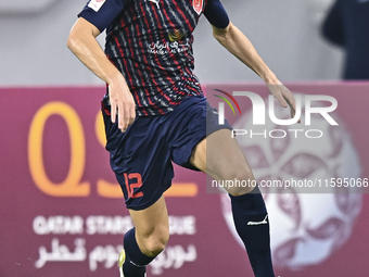 Karim Buddaif of Al Duhail SC plays in the Ooredoo Qatar Stars League 24/25 match between Al-Sadd SC and Al Duhail SC at Khalifa Internation...