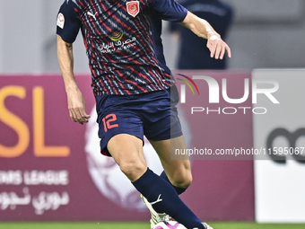 Karim Buddaif of Al Duhail SC plays in the Ooredoo Qatar Stars League 24/25 match between Al-Sadd SC and Al Duhail SC at Khalifa Internation...