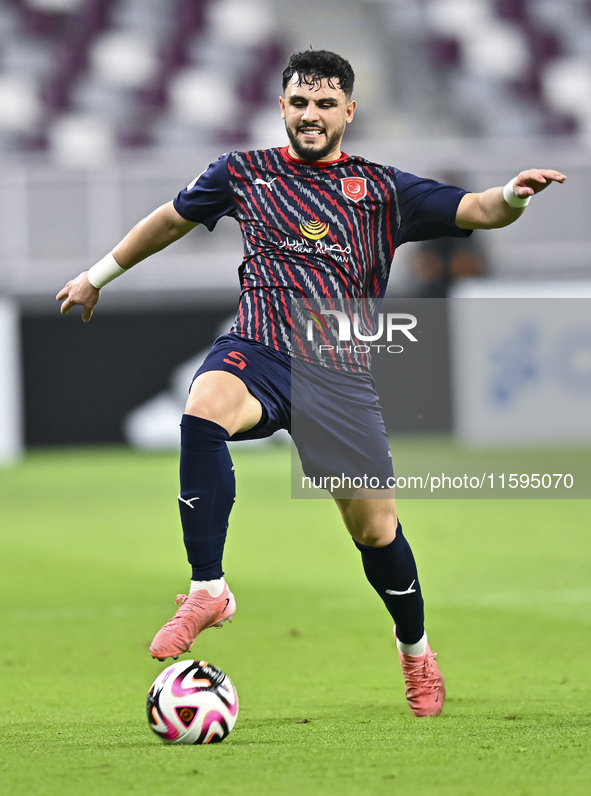 Bassam Hisham of Al Duhail SC plays in the Ooredoo Qatar Stars League 24/25 match between Al-Sadd SC and Al Duhail SC at Khalifa Internation...