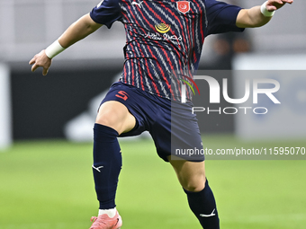 Bassam Hisham of Al Duhail SC plays in the Ooredoo Qatar Stars League 24/25 match between Al-Sadd SC and Al Duhail SC at Khalifa Internation...