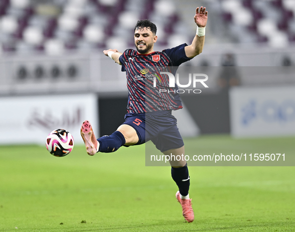 Bassam Hisham of Al Duhail SC plays in the Ooredoo Qatar Stars League 24/25 match between Al-Sadd SC and Al Duhail SC at Khalifa Internation...